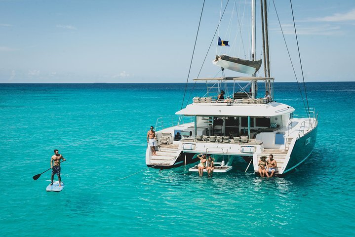 A catamaran sailing on turquoise water